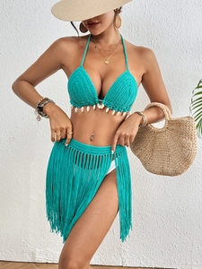 Women's lake green crochet bikini set with shell fringe skirt for beach vacations