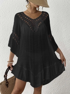 Women's black crochet beach cover-up with V-neck, hollow geometric knit and tassels