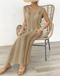Detailed knit texture of a khaki crochet beach cover-up dress with hollow-out stripes