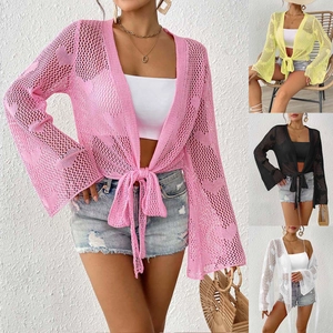 Detail of crochet bell sleeves and knit texture on the colorful beach cover-up tops
