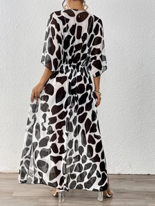 Women's leopard print mesh cover-up with batwing sleeves and elastic waist shown from the back