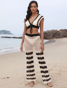 Detail of crochet beach set showing beige and black contrast wave knit pattern and texture