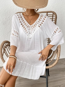 White boho V-neck beach dress with crochet lace detailing and tassel accents for women