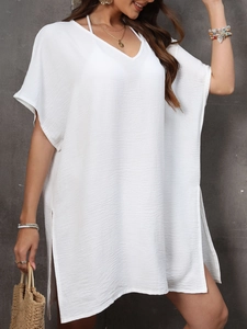 Detail of white V-neck cover-up dress featuring vertical texture and side slits