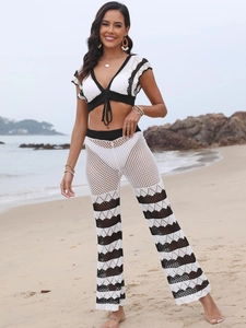 Women's two-piece crochet beach set with V-neck crop top and wide leg pants in black and white