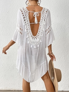 Bohemian white crochet beach cover-up dress with open back and tassel details