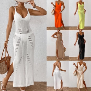 Detail of knitted cutout beach dress with deep V-neck, open back, and side slit design
