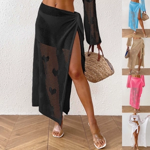 Detail showing heart-pattern crochet beach sarong wrap in five different colors