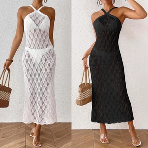 Detail of crochet knit beach dress with halter neck and hollow diamond pattern texture