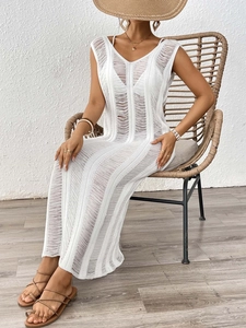 Detail of white crochet knit sleeveless V-neck maxi beach cover-up dress in vertical pattern