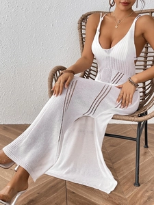 Detailed knit pattern on a white crochet beach dress with a sexy side slit and deep V-neck