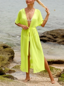 Détail du paréo de plage vert fluo transparent avec fentes latérales et cordon à la taille