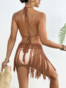 Back view of brown crochet beach set with fringe skirt and halter top tie detail
