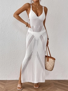 Detailed view of white crochet lace maxi dress featuring high side slit and knit texture
