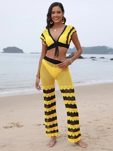 Bohemian yellow and black crochet two-piece beach set with V-neck top and flared trousers