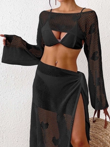 Close-up of heart jacquard mesh texture on black crochet beach cover-up set