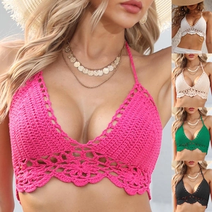 Detailed view of handmade crochet bikini top with floral openwork and neck ties