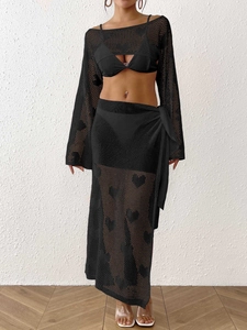 Three-piece black crochet set with heart hollow-out pattern, cropped top and tie-up skirt