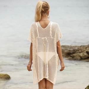 Detailed knit texture of beige crochet beach cover-up dress with hollow-out mesh design