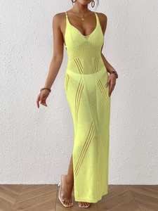 Detailed close-up of lime green crochet knit beach dress with side slit and wave pattern