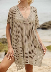 Detail of khaki crochet knit beach cover-up with V-neckline and boho hollow texture