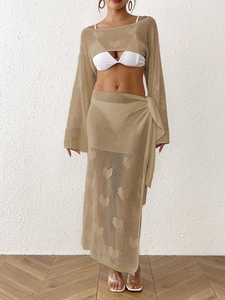 Detail of crochet knit heart pattern and hollow mesh texture on bohemian beige set