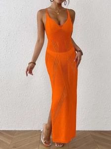 Detail of orange crochet beach dress with spaghetti straps and side slit design