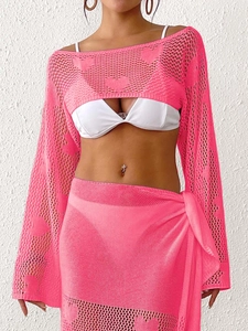 Detail of hot pink heart-shaped hollow knit crochet cover-up set for beach vacation