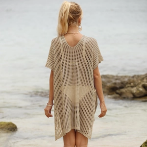Detailed knit texture of khaki beach cover-up featuring crochet hollow out pattern
