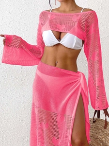 Detail of hot pink crochet bikini cover-up set with heart pattern and mesh texture