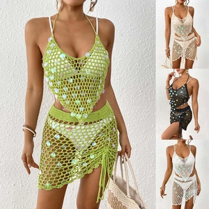 Detail of crochet knit texture with sequins and drawstring on women's two-piece skirt set
