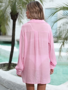 Rear view of loose pink beach shirt showing lightweight translucent fabric and back pleat