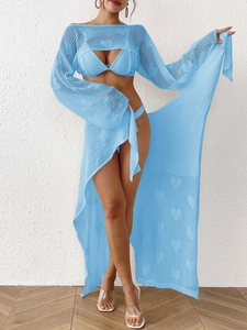 Detail of light blue mesh cover-up featuring heart-shaped hollow patterns and texture