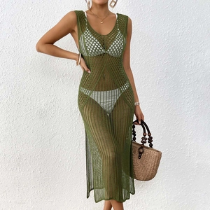 Detail of green crochet hollow knit maxi dress with deep V-neck and side slit design