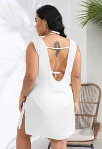 Macro shot of white backless beach cover-up in breathable fabric with high side slits