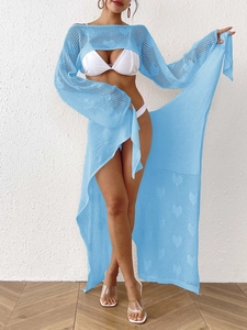 Light blue crochet two-piece set featuring heart cutout top and tie-waist slit skirt