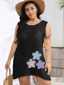 Detail of floral embroidery on a black sleeveless plus size beach cover up dress