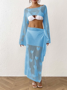 Close-up of sky blue knit beach set with heart-shaped crochet hollow patterns