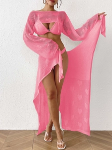 Pink three-piece crochet beach cover-up set with heart patterns and uneven tie-up skirt