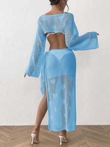 Back view of blue crochet two-piece set featuring heart cutout patterns and open back design