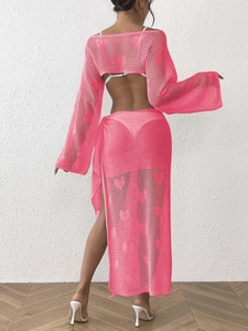 Detail of heart jacquard knit top and skirt set in fuchsia with hollow out pattern