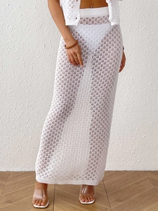 White crochet hollow-out maxi skirt set with geometric patterns for beach vacation