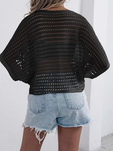 Detail of black hollow out crochet knit top with batwing sleeves and mesh texture