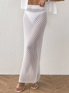 Elegant white crochet long skirt set with hollow-out knit design for beach vacation