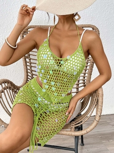Detailed view of neon green sequin crochet knit beach set with skirt and top