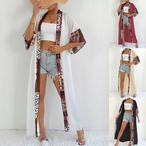 Close-up of ethnic floral patchwork trim on various colors of long sun protection cardigans
