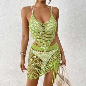 Detail of neon green crochet bikini set with shimmering sequins and drawstring skirt