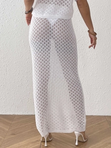 Detailed back view of white crochet knit beach cover-up skirt with hollow-out texture
