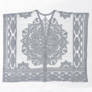 Macro detail of grey crochet lace cardigan with bohemian mandala floral embroidery