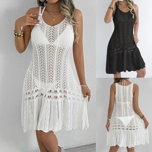 Detailed macro view of crochet knit patterns and hollow out textures on beach cover-up dresses